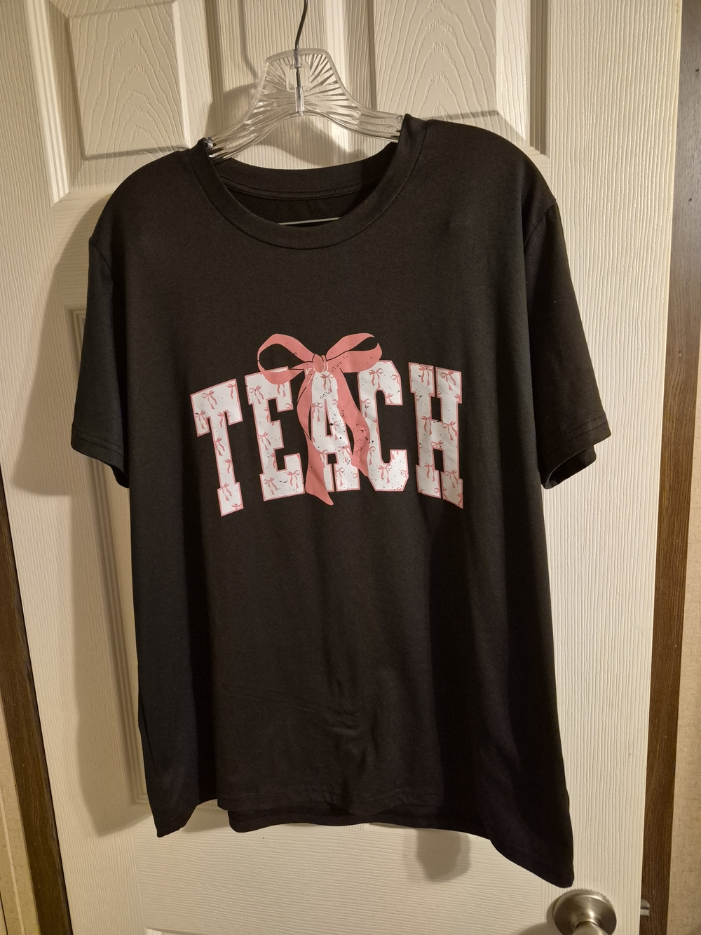 Aldo Black Tee with Pink 'TEACH' Graphic
